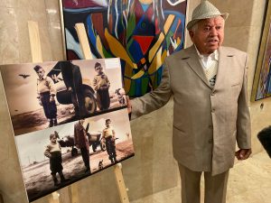Dov Scaggio - Holocaust survivor, standing next to a picture created for him with AI