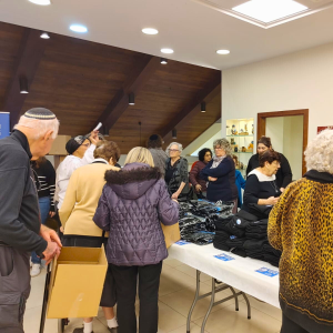 Holocaust Survivors in Israel Volunteered to assemble winter care packages for IDF Soldiers.