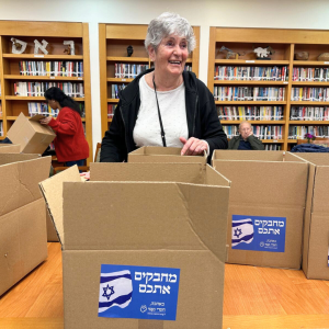 Holocaust Survivors in Israel Volunteered to assemble winter care packages for IDF Soldiers.