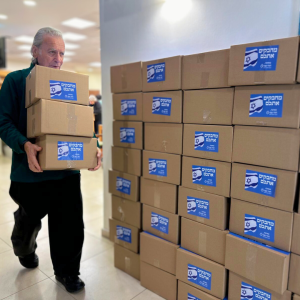 Holocaust Survivors in Israel Volunteered to assemble winter care packages for IDF Soldiers.