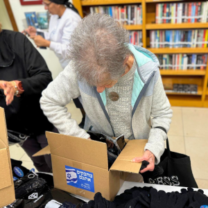 Holocaust Survivors in Israel Volunteered to assemble winter care packages for IDF Soldiers.