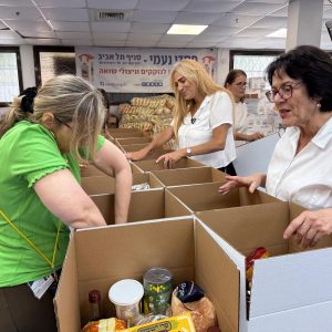 Volunteers pack food baskets for Rosh Hashanah